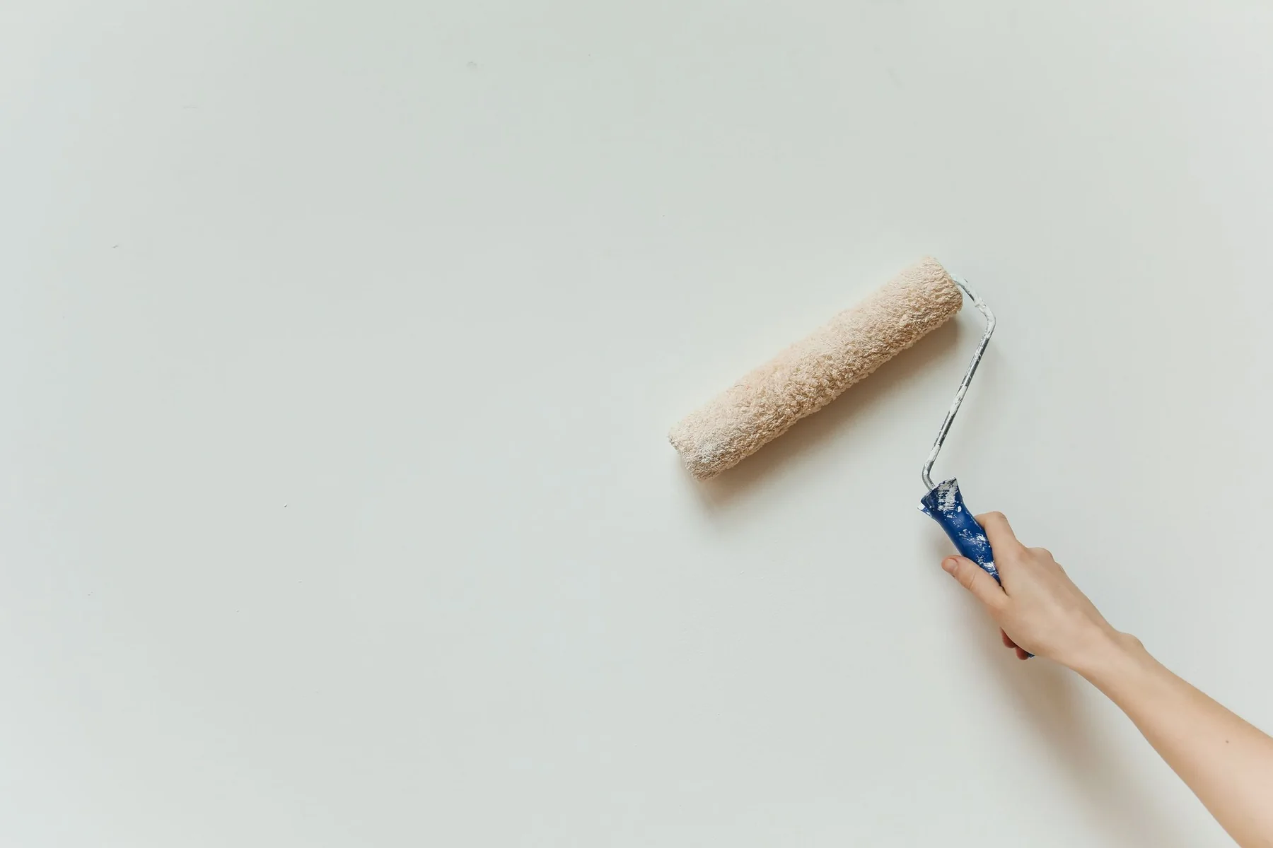 Paint roller applying a clean finish
